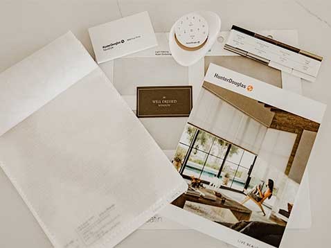 Collection of Hunter Douglas media on a desk